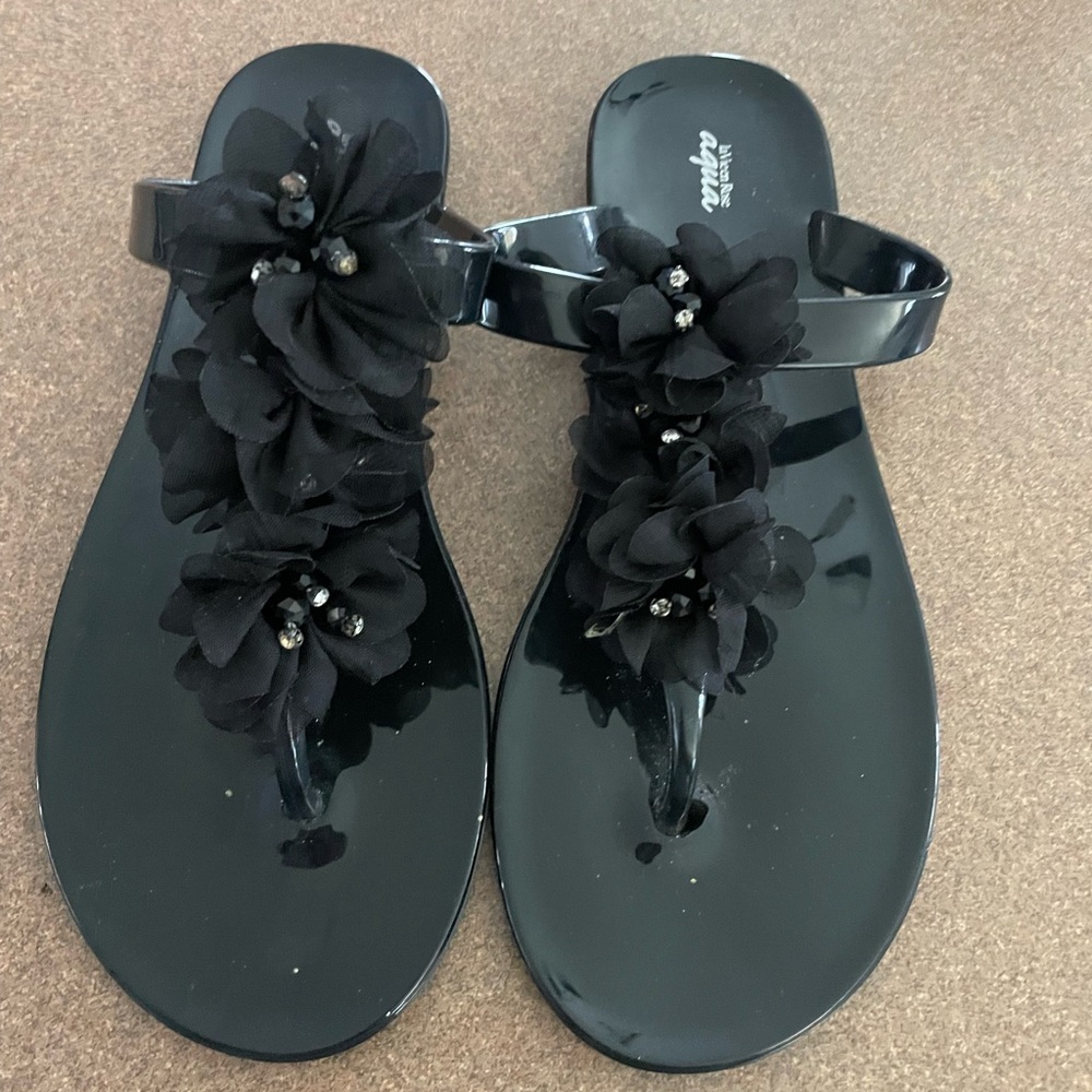 Beach/pool sandals. Black with sparkly ribbon along top. Size 8 Worn once. EUC.